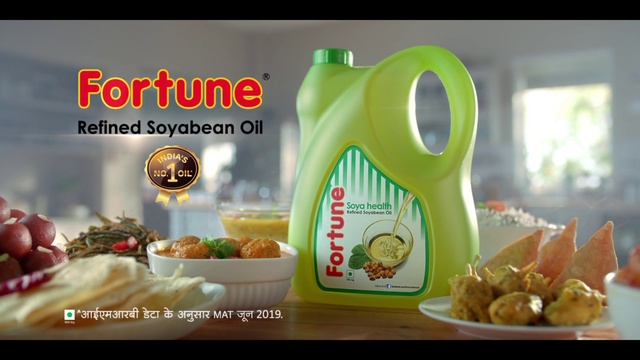 Video Reference: Product, Junk food, Food, Cooking oil, Natural foods, Snack, Rice bran oil, Ingredient, Dish, Person, Photo, Table, Sitting, Plate, Fruit, Black, Computer, Banana, Different, Cake, Woman, White, Text, Fast food, Bottle
