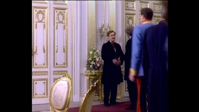 Video Reference: purple, dress, standing, suit, outerwear, gentleman, formal wear, religion, ceremony, tradition, Person