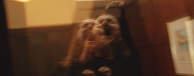 Video Reference: Brown, Room, Mouth, Fun, Photography, Wood, Facial hair, Reflection, Indoor, Sitting, Blurry, Cat, Looking, Dog, Laptop, Computer, Desk, Front, Table, Mirror, Remote, Television, Fireplace, Living, Control, Holding, White, Laying, Woman, Video, Bed, Standing, Playing, Blur