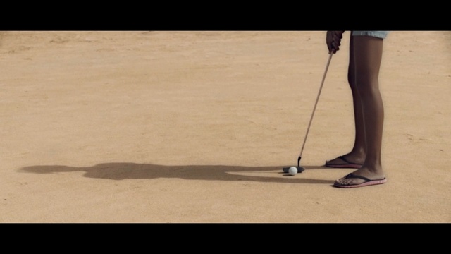 Video Reference: Golf equipment, Golf club, Golf, Leg, Putter, Human leg, Golfer, Walking, Recreation, Sand