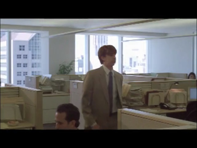 Video Reference: Snapshot, Furniture, Room, Desk, Standing, Window, Daylighting, Office, Interior design, Architecture, Person