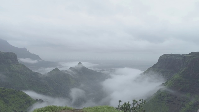 Video Reference: Mountainous landforms, Highland, Mist, Atmospheric phenomenon, Mountain, Hill station, Sky, Fog, Natural landscape, Mountain range