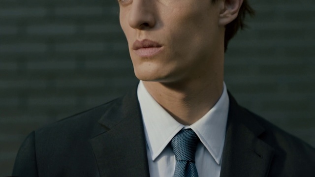 Video Reference: Suit, Formal wear, White-collar worker, Chin, Tie, Forehead, Outerwear, Collar, Cheek, Tuxedo