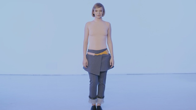 Video Reference: blue, fashion model, standing, shoulder, fashion, runway, joint, neck, sky, fashion design, Person