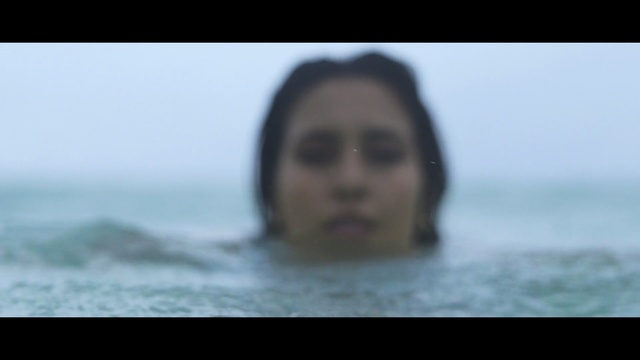 Video Reference: Face, Hair, Photograph, Facial expression, Sea, Nose, Eyebrow, Head, Black hair, Water, Person