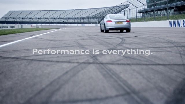 Video Reference: car, asphalt, mode of transport, race track, vehicle, structure, road, motor vehicle, automotive exterior, line