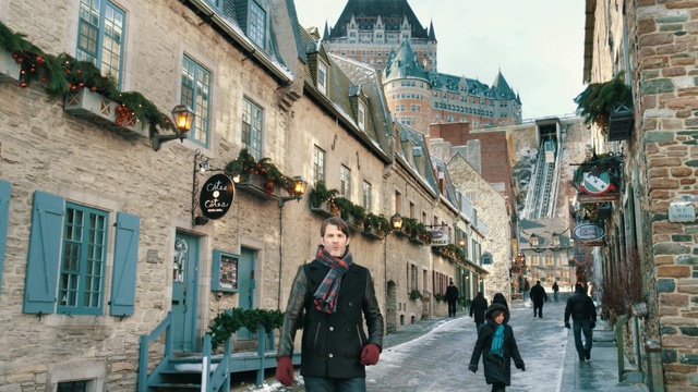 Video Reference: town, street, city, infrastructure, urban area, neighbourhood, wall, road, building, tourism, Person