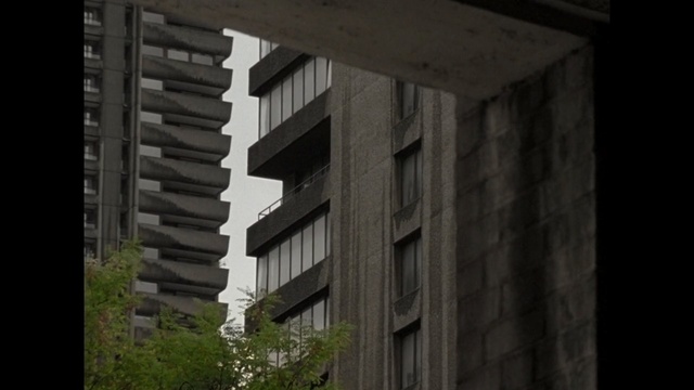 Video Reference: building, architecture, structure, residential area, urban area, wall, facade, sky, window, brutalist architecture