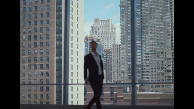 Video Reference: Urban area, Metropolitan area, City, Standing, Human settlement, Metropolis, Tower block, Skyscraper, Sky, Architecture, Building, Outdoor, Window, Front, Man, Black, Woman, Water, Large, Young, Riding, Walking, Jumping, Tall, Holding, Air, Street, Clothing, Person, Downtown