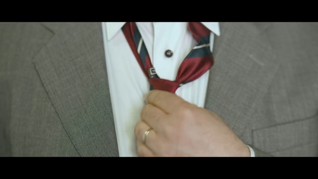 Video Reference: Tie, Red, Hand, Finger, Fashion accessory, Shirt, Collar, Suit, Neck, Formal wear