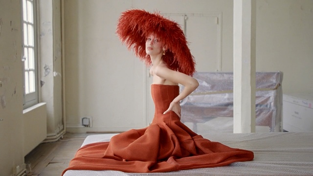 Video Reference: Hair, Red hair, Orange, Dress, Long hair, Leg, Wig, Flesh, Hair coloring, Brown hair, Person