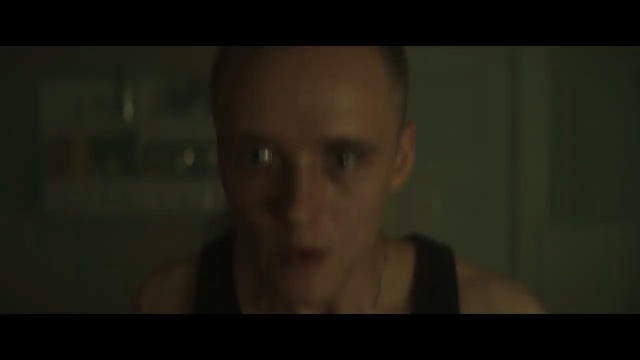 Video Reference: Face, Black, Nose, Eyebrow, Head, Portrait, Skin, Cheek, Darkness, Forehead, Indoor, Man, Person, Looking, Sitting, Photo, Front, Mirror, Table, Shirt, Glasses, Holding, Young, Smiling, Room, Wearing, Reflection, Food, Screen, Glass, Cake, Blurry, Red, White, Teeth, Screenshot, Human face, Eyes, Dark, Text