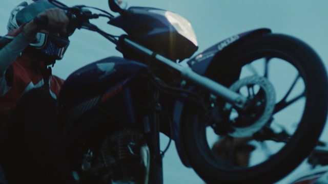 Video Reference: Motor vehicle, Motorcycle, Vehicle, Sky, Auto part, Wheel, Spoke, Automotive tire, Headlamp, Photography