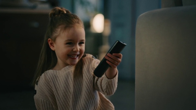 Video Reference: Hair, Child, Gadget, Hairstyle, Beauty, Blond, Cheek, Smartphone, Technology, Electronic device