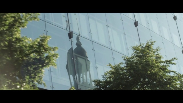 Video Reference: Sky, Tree, Overhead power line, Architecture, Facade, Cable car, Reflection, Sunlight, Plant, Window