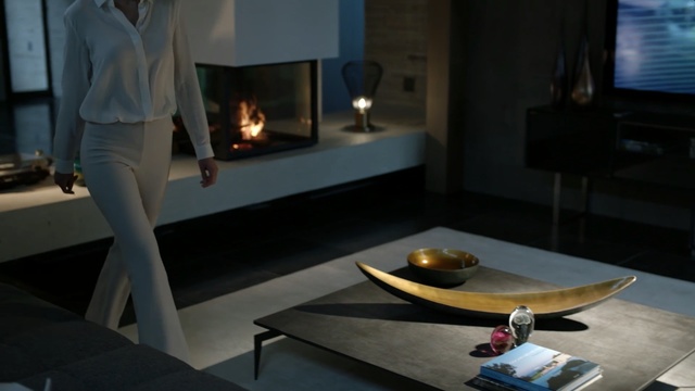 Video Reference: Room, Property, Fireplace, Table, Interior design, Furniture, Living room, Hearth, House, Coffee table