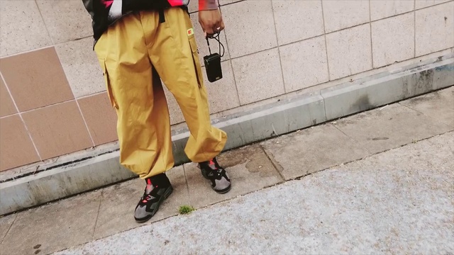 Video Reference: Street fashion, Yellow, Leg, Footwear, Jeans, Shoe, Trousers, Sportswear, Waist, Person