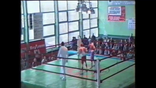 Video Reference: Sport venue, Sports, Boxing ring, Individual sports, Boxing equipment, Sports equipment, Leisure centre, Leisure, Contact sport, Display device, Man, Game, Young, Room, Standing, Riding, Doing, Woman, Table, People, Holding, Playing, Board, Jumping, Water, Ball, Group, Court, Text, Swimming, Person, Swimming pool