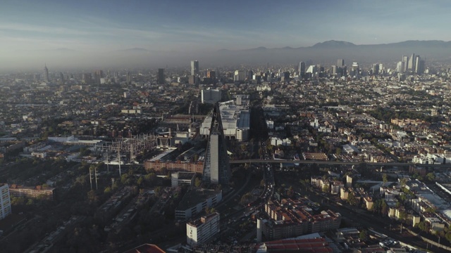 Video Reference: Cityscape, Metropolitan area, Urban area, City, Aerial photography, Metropolis, Birds-eye view, Skyline, Human settlement, Suburb