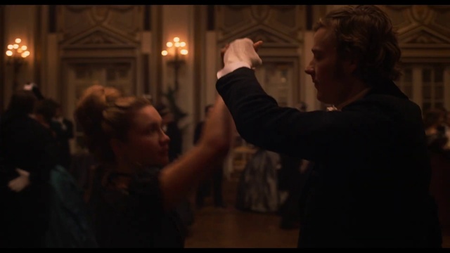 Video Reference: Photograph, Event, Photography, Darkness, Performance, Gesture, Ceremony, Dance, Screenshot, Scene, Person, Man, Indoor, Looking, Standing, Front, Holding, Photo, Glasses, Dark, Mirror, Lit, Phone, Woman, Wearing, Room, Wine, Shirt, Light, Young, Table, Kitchen, Suit, Living, Video, People, Blurry, Remote, Playing, White, Human face, Candle, Clothing, Crowd