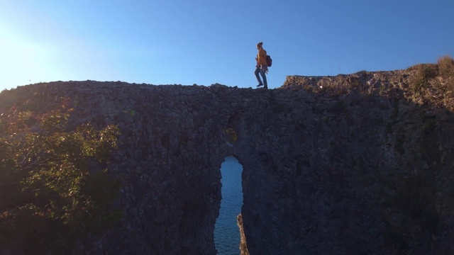 Video Reference: Cliff, Water, Terrain, Formation, Sky, Rock, Reflection, Klippe, Sea, Fault