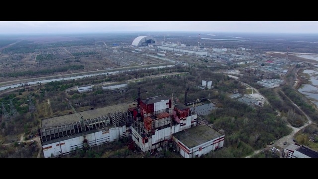 Video Reference: Aerial photography, Bird-eye view, Urban area, Metropolitan area, City, Landmark, Human settlement, Urban design, Suburb, Photography, Mountain, Outdoor, View, Grass, Ship, Hill, Snow, White, Large, Covered, Field, Train, Red, Traveling, Bus, Airplane, Skiing, Track, Standing, Sign, Plane, Riding, Skyscraper, Building, Sky, Landscape, Screenshot, Tower