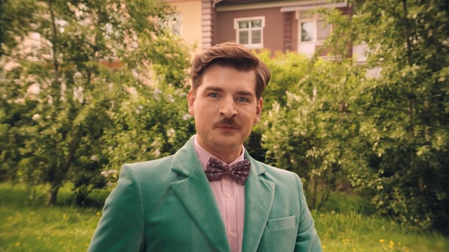 Video Reference: green, photograph, man, suit, male, tree, grass, formal wear, gentleman, outerwear, Person