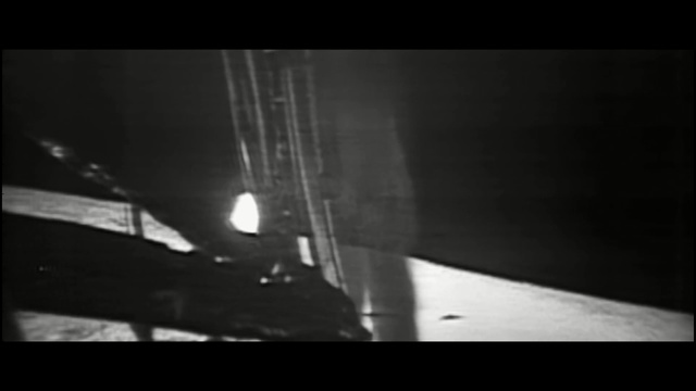 Video Reference: Black, White, Darkness, Photograph, Monochrome photography, Black-and-white, Light, Monochrome, Atmosphere, Snapshot, Indoor, Table, Computer, Sitting, Laptop, Desk, Dark, Monitor, Photo, Room, Screen, Man, Keyboard, Woman, Blurry, Desktop, Standing, Holding, People, Black and white, Screenshot, Shadow, Water, Text, Abstract, Image