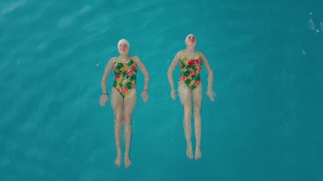 Video Reference: Synchronized swimming, Swimming, Recreation, Swimmer, Fun, Swimwear, Individual sports, Leisure, Swimming pool, Vacation