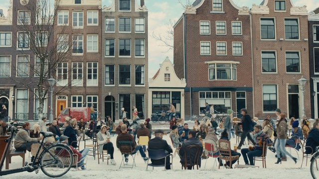 Video Reference: land vehicle, urban area, town, city, vehicle, neighbourhood, building, mixed use, street, downtown, Person