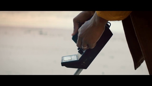 Video Reference: Hand, Arm, Finger, Leg, Table, Font, Photography, Human leg, Elbow, Gadget