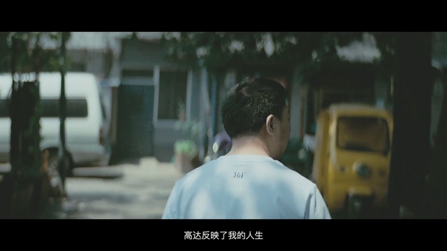 Video Reference: Photograph, Mode of transport, Snapshot, Human, Photography, Movie, Photo caption, Screenshot, Automotive window part, Person, Man, Looking, Front, Holding, Standing, Sitting, Computer, Laptop, Table, Street, Phone, Food, Screen, Bus, Room, Television, White, Red, City, Train, Human face, Text