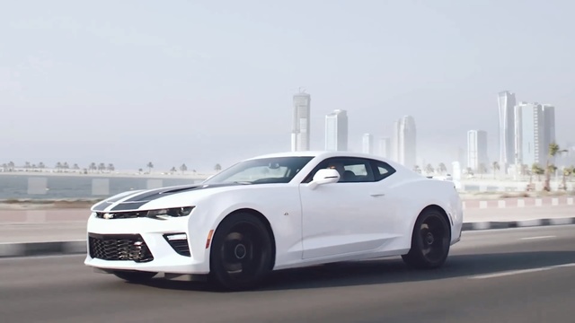 Video Reference: Land vehicle, Vehicle, Car, Chevrolet camaro, White, Automotive design, Motor vehicle, Muscle car, Coupé, Performance car, Person