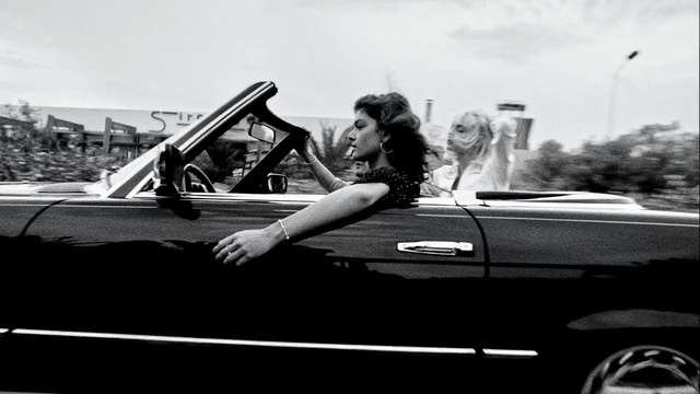 Video Reference: car, land vehicle, black, black and white, motor vehicle, vehicle, monochrome photography, photography, automotive design, vehicle door, Person