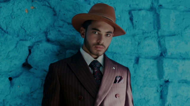 Video Reference: Suit, Hat, Headgear, Outerwear, Fedora, Formal wear, Fashion accessory