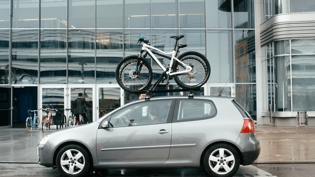 Video Reference: motor vehicle, car, vehicle, automotive design, wheel, automotive wheel system, building, rim, volkswagen, hatchback, Person