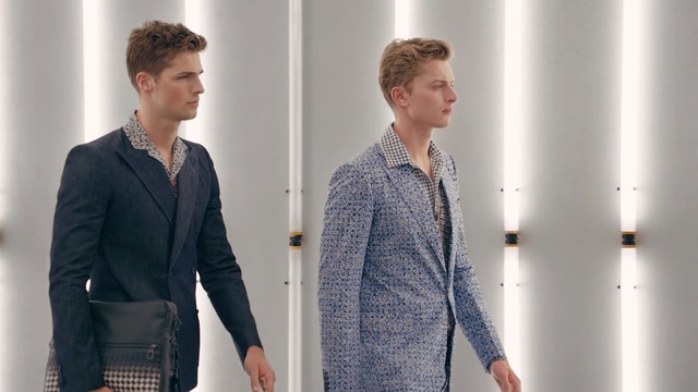 Video Reference: Clothing, Outerwear, Suit, Blazer, White-collar worker, Standing, Fashion, Shoulder, Sleeve, Formal wear