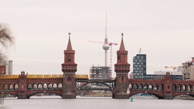 Video Reference: Landmark, City, Building, Human settlement, Spire, Architecture, Tower, Urban area, Bridge, Sky