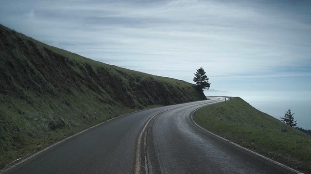 Video Reference: road, highland, mountain pass, infrastructure, mountainous landforms, sky, highway, mode of transport, road trip, asphalt