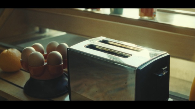 Video Reference: Room, Material property, Table, Electronics, Furniture, Flooring, Wood, Toaster, Electronic instrument, Home appliance