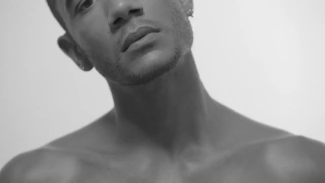 Video Reference: Face, White, Chin, Photograph, Neck, Shoulder, Skin, Lip, Cheek, Nose, Man, Person, Looking, Clothing, Mirror, Hair, Wearing, Camera, Photo, Standing, Front, Brushing, Black, Teeth, Shirt, Young, Suit, Hat, Holding, Brush, Human face, Black and white, Portrait, Statue, Staring