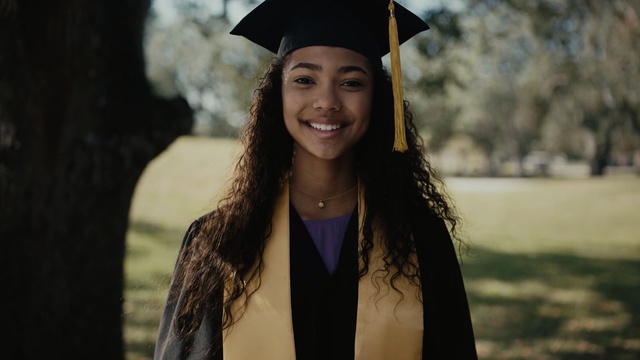 Video Reference: graduation, facial expression, girl, academic dress, beauty, smile, event, long hair, fun, mortarboard, Person