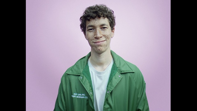 Video Reference: Green, Face, Forehead, Cheek, Chin, Male, Human, Shoulder, Jaw, Outerwear, Person