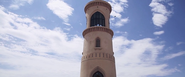 Video Reference: Tower, Landmark, Sky, Architecture, Building, Arch, Place of worship, Bell tower, Cloud, Medieval architecture