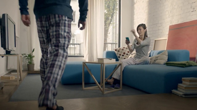 Video Reference: Room, Interior design, Furniture, Living room, Leg, Couch, Sitting, Floor, Table, Human leg