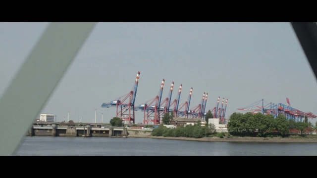 Video Reference: Metropolitan area, Urban area, Waterway, Crane, Skyline, Port, Infrastructure, City, Vehicle, Ferris wheel
