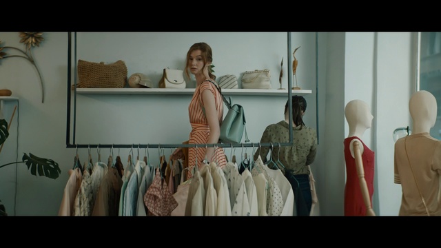 Video Reference: Room, Fashion design, Textile, Dress, Boutique, Art, Person, Photo, Different, White, Mirror, Various, Table, Man, Bunch, Display, Sink, Counter, Large, Several, Holding, Woman, Standing, Group, Clothing, Human face