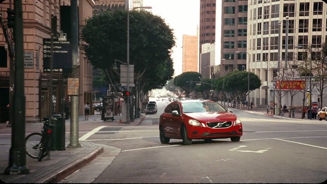 Video Reference: car, land vehicle, luxury vehicle, vehicle, city, road, urban area, street, motor vehicle, family car, Person