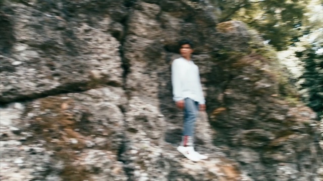 Video Reference: tree, woody plant, plant, winter, rock, forest, girl, adventure, fun, recreation, Person