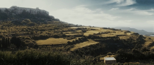 Video Reference: sky, hill, highland, shrubland, escarpment, mountain, ridge, rural area, terrain, plateau, Person